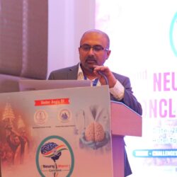 Dr Mohana Rao Patibandla speaking at Neurobharat Conclave 2026 Varanasi neurosurgery conference presentation