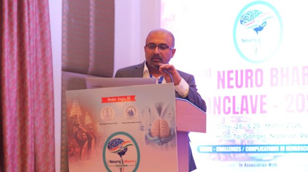 Dr Mohana Rao Patibandla speaking at Neurobharat Conclave 2026 Varanasi neurosurgery conference presentation