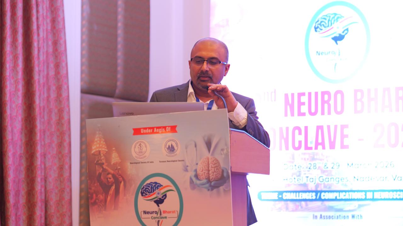 Dr Mohana Rao Patibandla speaking at Neurobharat Conclave 2026 Varanasi neurosurgery conference presentation