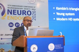 Dr. Mohana Rao Patibandla presenting on Percutaneous Endoscopic Lumbar Discectomy (PELD) at NEUROENDOCON 2026 conference in Jaipur