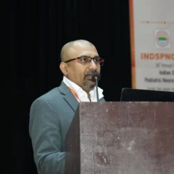 Dr Mohana Rao Patibandla speaking at INDSPNCON 2026 about advanced pediatric neurosurgery techniques including minimally invasive brain surgery and neuro-navigation at Dr Rao’s International Institute of Neurosciences
