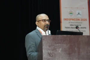 Dr Mohana Rao Patibandla speaking at INDSPNCON 2026 about advanced pediatric neurosurgery techniques including minimally invasive brain surgery and neuro-navigation at Dr Rao’s International Institute of Neurosciences