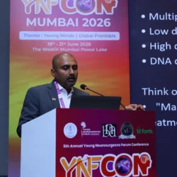 Dr. Mohana Rao Patibandla delivering a lecture on stereotactic radiosurgery at YNFCON 2026 Mumbai, discussing advanced minimally invasive neurosurgical treatment techniques for young neurosurgeons.
