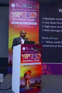 YNFCON Dr. Mohana Rao Patibandla delivering an invited lecture on stereotactic radiosurgery at YNFCON 2026 Mumbai, discussing the principles and applications of precision minimally invasive neurosurgery.